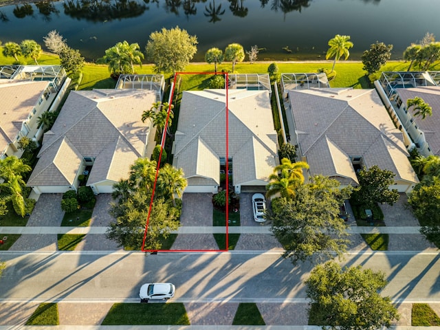 birds eye view of property featuring a water view