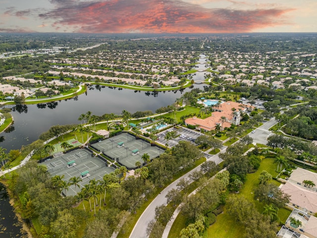 aerial view at dusk with a water view