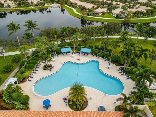 view of swimming pool with a water view