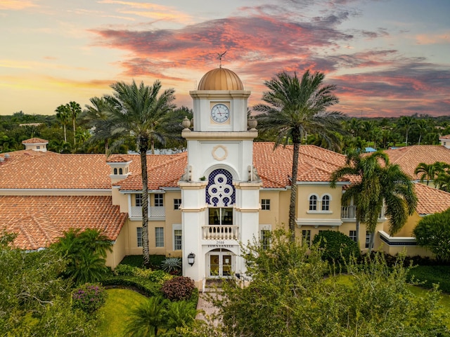 view of outdoor building at dusk