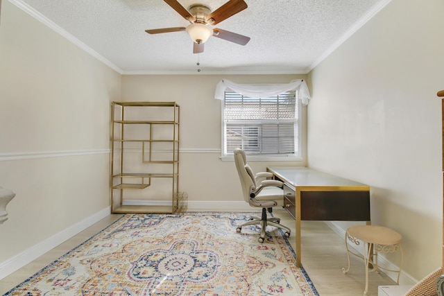 office area with a textured ceiling, ceiling fan, and crown molding