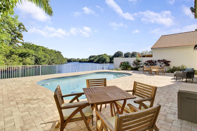 view of swimming pool with a patio