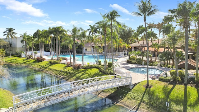 view of swimming pool with a water view