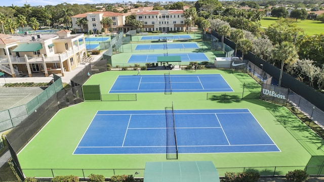 view of tennis court featuring basketball court