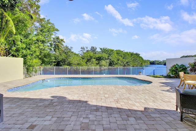 view of swimming pool featuring a patio area