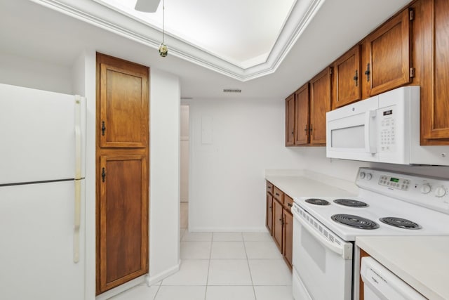 kitchen with white appliances and light tile patterned floors