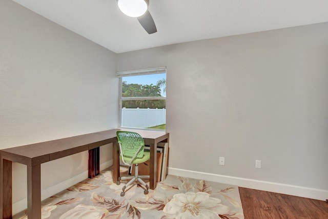 home office featuring a ceiling fan and baseboards