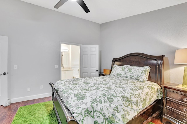 bedroom featuring ceiling fan, connected bathroom, and dark hardwood / wood-style floors