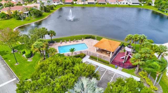 drone / aerial view featuring a water view and a residential view