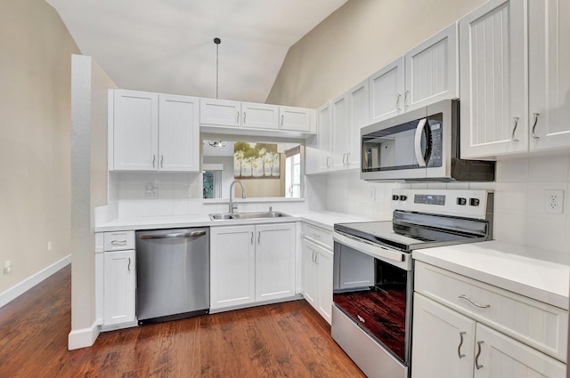 kitchen featuring tasteful backsplash, appliances with stainless steel finishes, light countertops, and a sink