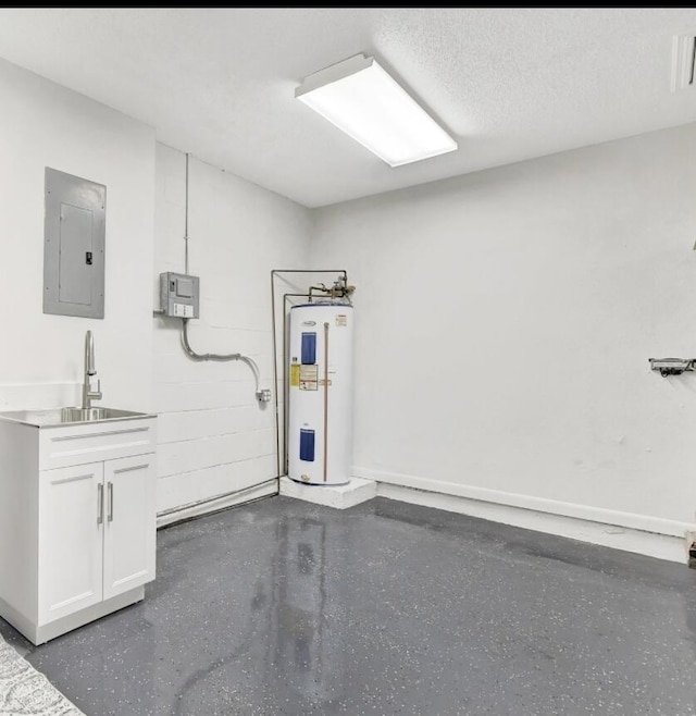 garage featuring sink, electric panel, and electric water heater