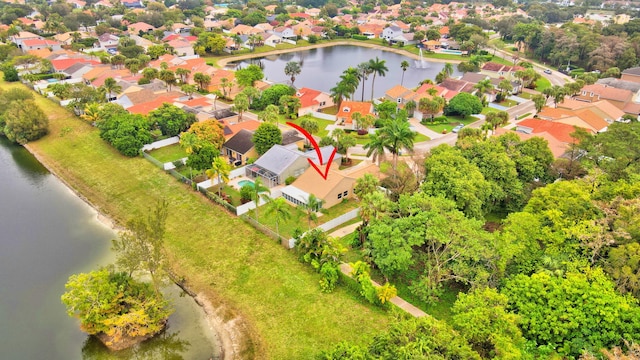 birds eye view of property featuring a water view