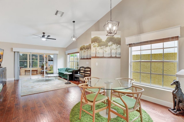 dining area with a ceiling fan, visible vents, baseboards, and wood finished floors