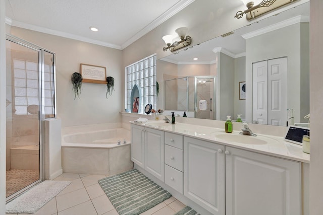 bathroom featuring independent shower and bath, vanity, ornamental molding, and tile patterned floors