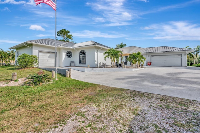 single story home with a front lawn and a garage