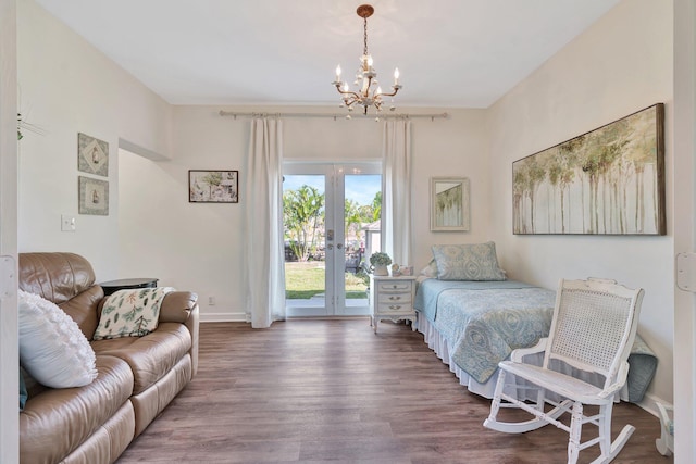 bedroom with french doors, access to exterior, a chandelier, and hardwood / wood-style flooring