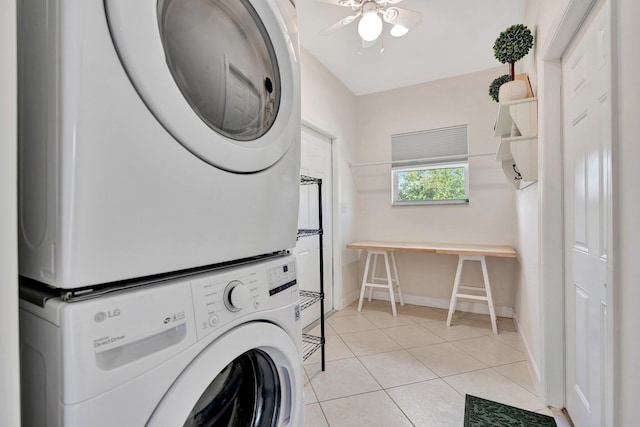 washroom with stacked washer and clothes dryer, ceiling fan, and light tile patterned floors