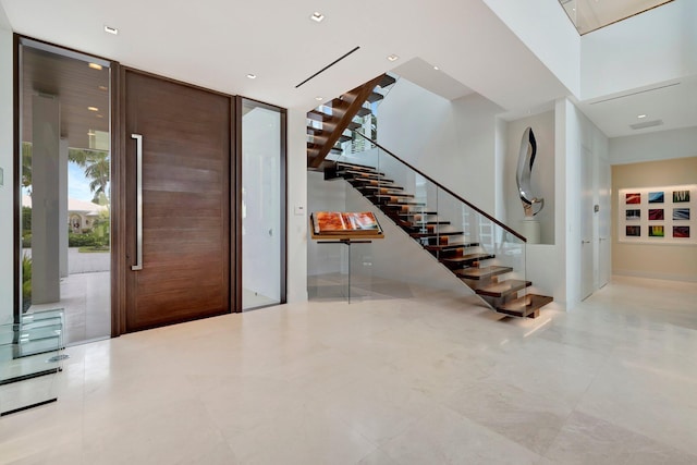 foyer entrance with floor to ceiling windows