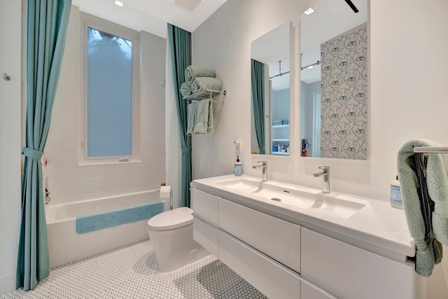 full bathroom featuring toilet, vanity, tile patterned flooring, and shower / bath combo