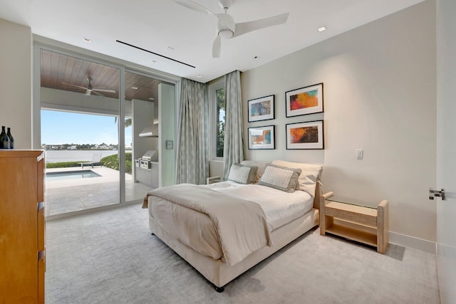 bedroom featuring access to outside, ceiling fan, and light carpet