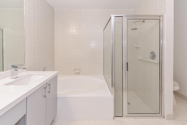 full bathroom with shower with separate bathtub, vanity, toilet, and tile patterned floors