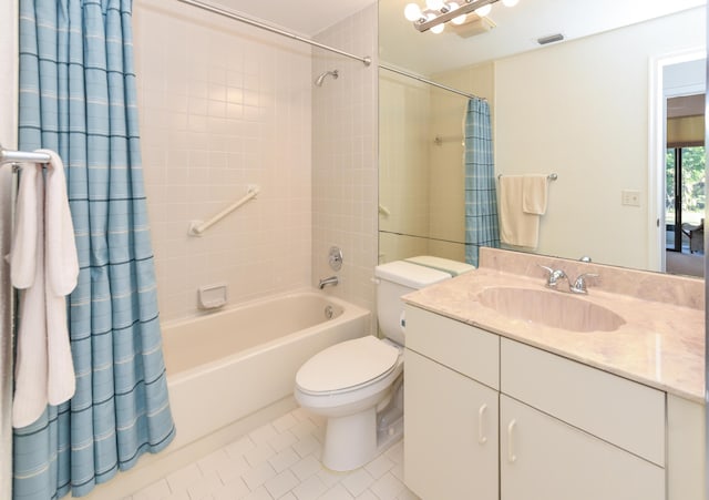 full bathroom with tile patterned flooring, vanity, toilet, and shower / tub combo