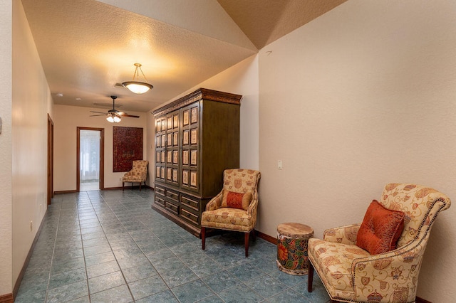 sitting room featuring vaulted ceiling