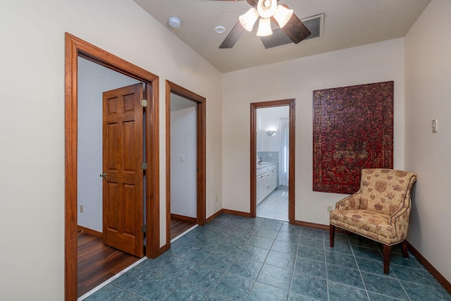 living area featuring ceiling fan