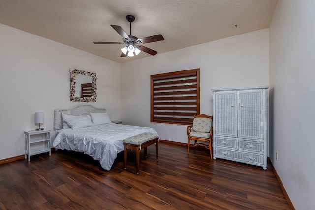 bedroom featuring a textured ceiling, ceiling fan, and dark hardwood / wood-style floors