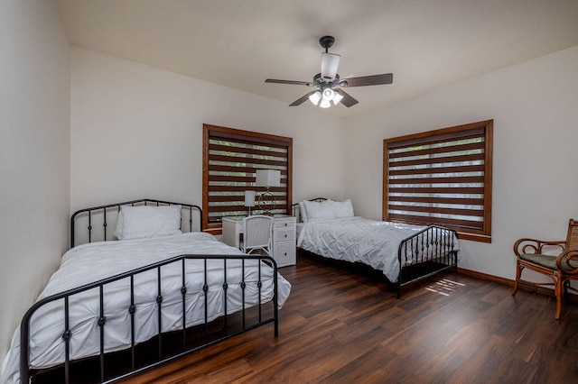 bedroom featuring ceiling fan and dark wood-type flooring