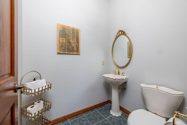 bathroom featuring tile patterned floors and toilet