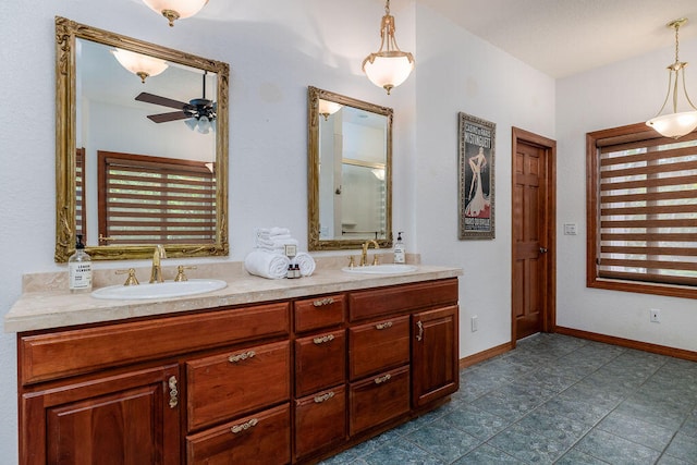 bathroom with ceiling fan and vanity