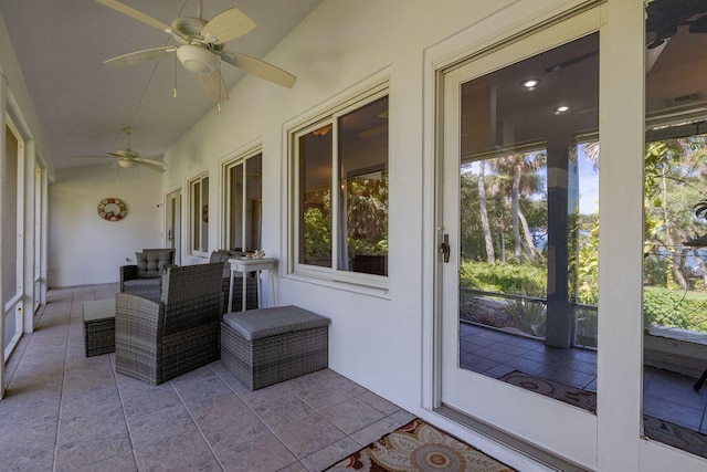 sunroom / solarium with a healthy amount of sunlight and lofted ceiling