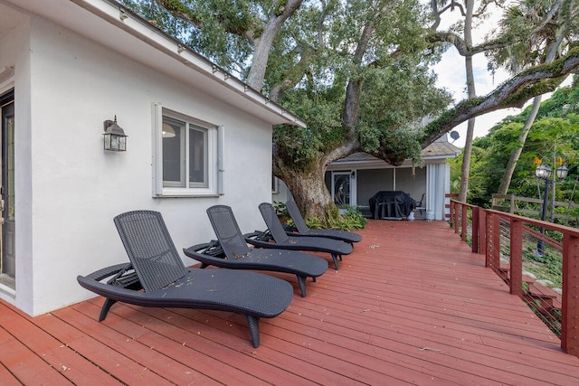 wooden deck with area for grilling