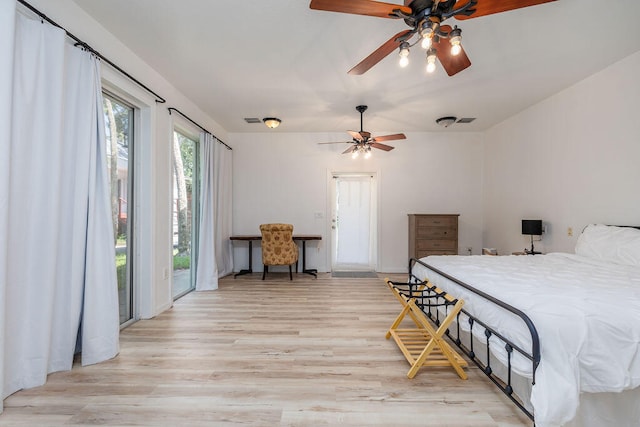 bedroom featuring ceiling fan, access to exterior, and light hardwood / wood-style flooring