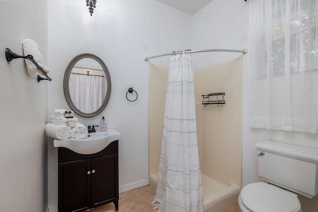 bathroom with a shower with shower curtain, vanity, toilet, and tile patterned flooring