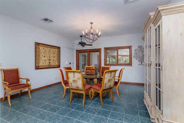 dining space featuring french doors and ceiling fan with notable chandelier