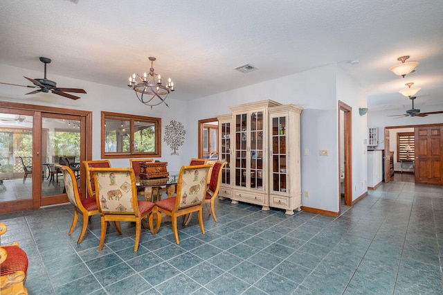 dining area with ceiling fan with notable chandelier and french doors