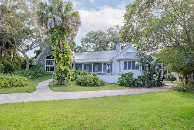 ranch-style home featuring a front yard