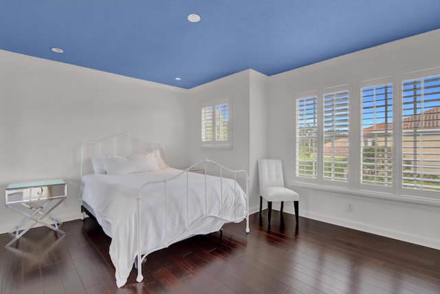 bedroom featuring dark hardwood / wood-style flooring