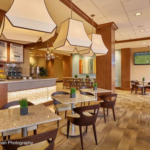 dining area featuring carpet floors and an inviting chandelier