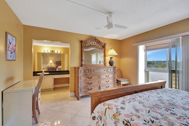 tiled bedroom featuring access to exterior, ceiling fan, built in desk, and a textured ceiling