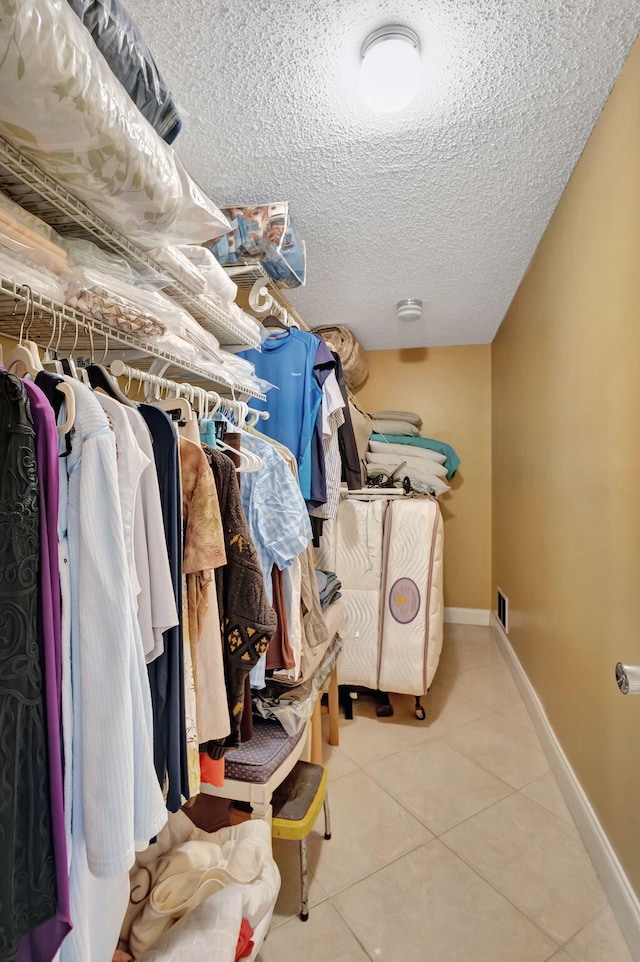 spacious closet with tile patterned flooring