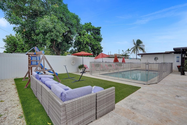 view of pool featuring an outdoor hangout area, a patio area, and a yard