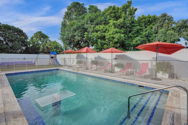 view of swimming pool with a patio