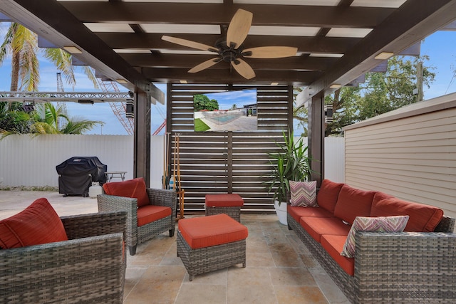 view of patio with grilling area, an outdoor living space, and ceiling fan