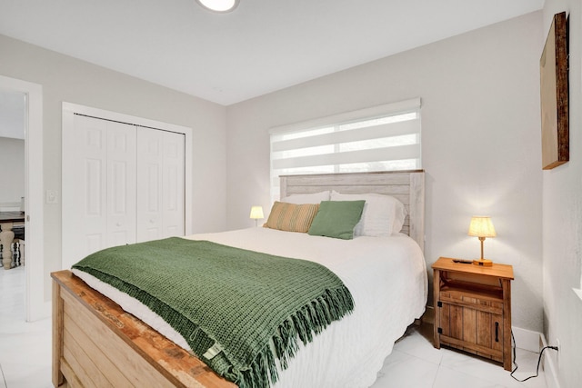 bedroom featuring light tile patterned flooring and a closet