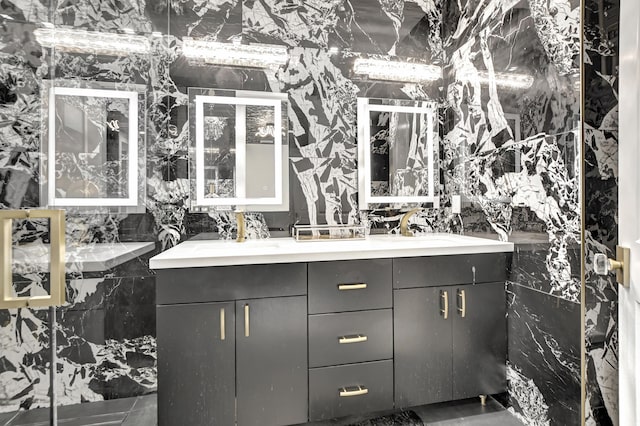 bathroom with tile walls and vanity