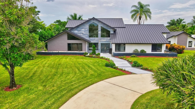 view of front of home with a front lawn