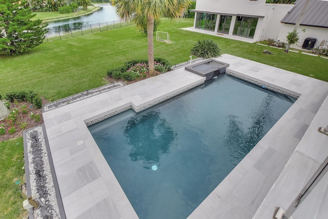 view of swimming pool featuring a water view, a jacuzzi, and a yard